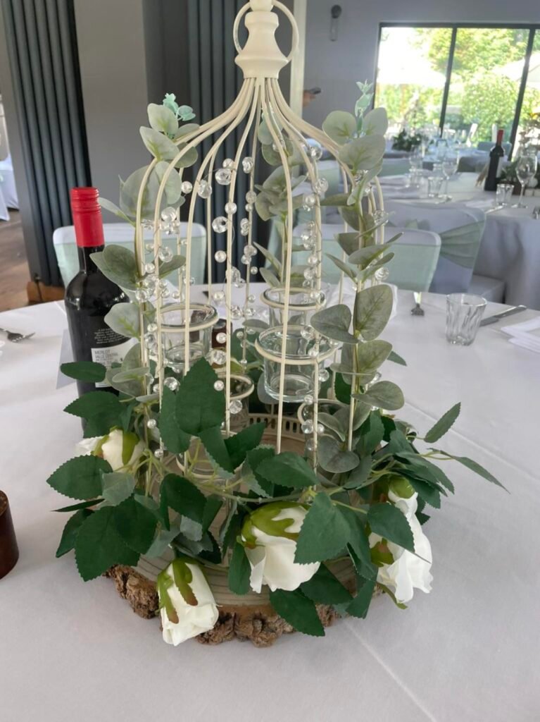 Cream Birdcage Table Centrepiece on Log Slice